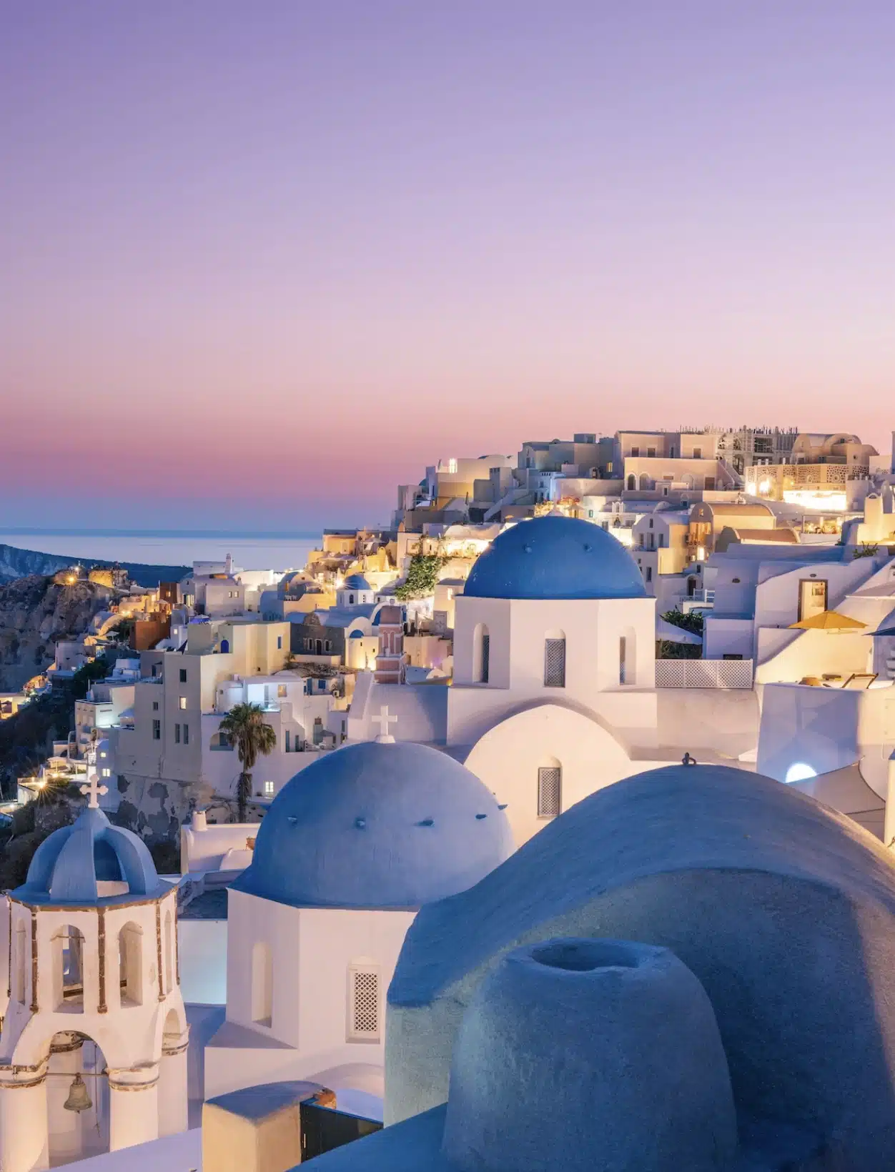 The iconic blue and white domes of Santorini Greece.